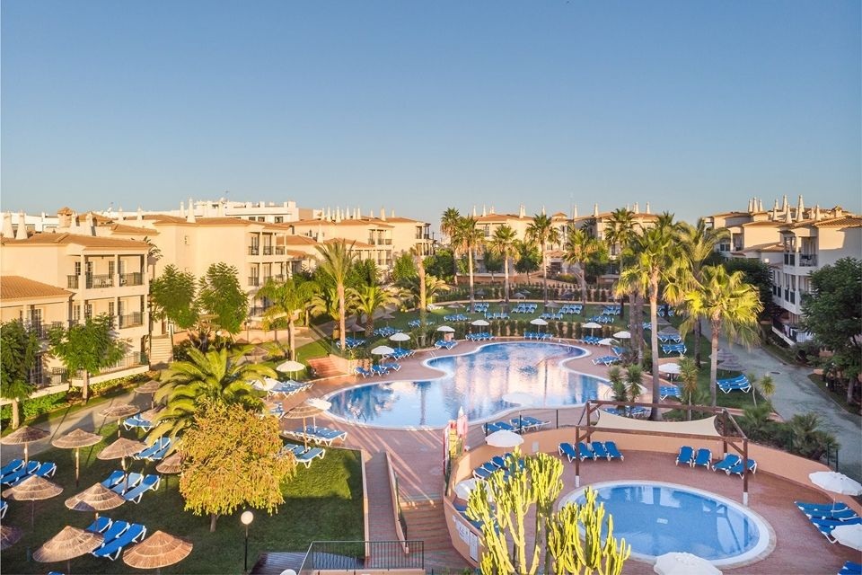 Main pool, children's pool, and apartment blocks at 3HB Clube Humbria, Olhos de Água