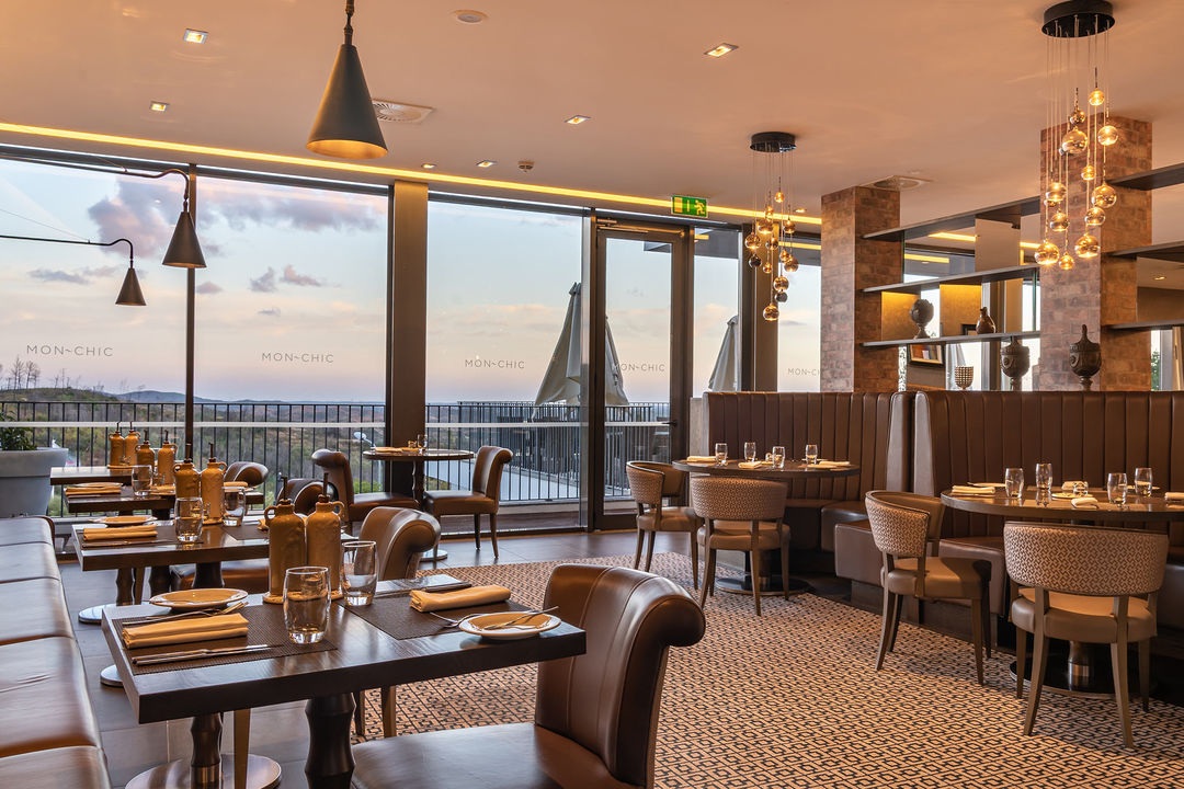 Mon Chic restaurant interior with hill views at dusk, Monchique Resort & Spa