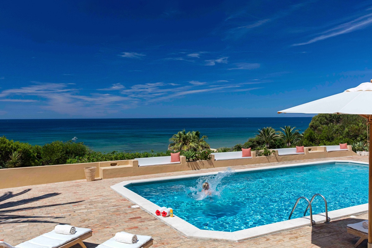 Ocean-view pool terrace at Vila Joya Galé